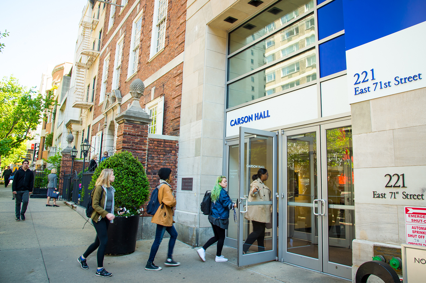 Students walking outside Carson Hall, Northeastern University's New York City campus at 221 East 71st Street.