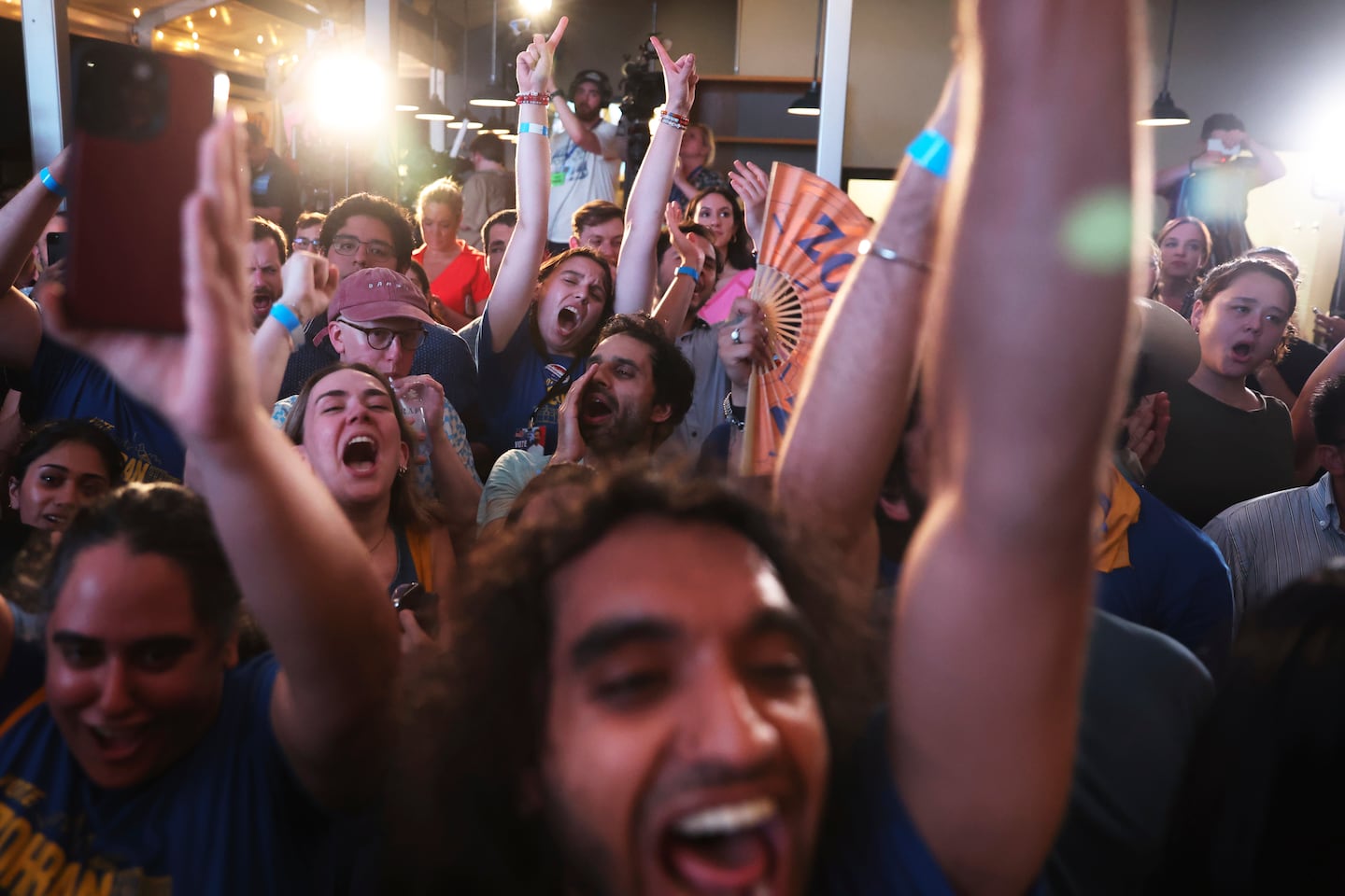 Supporters of Mamdani cheered before he took, the stage at his primary election party on June 25, 2025.