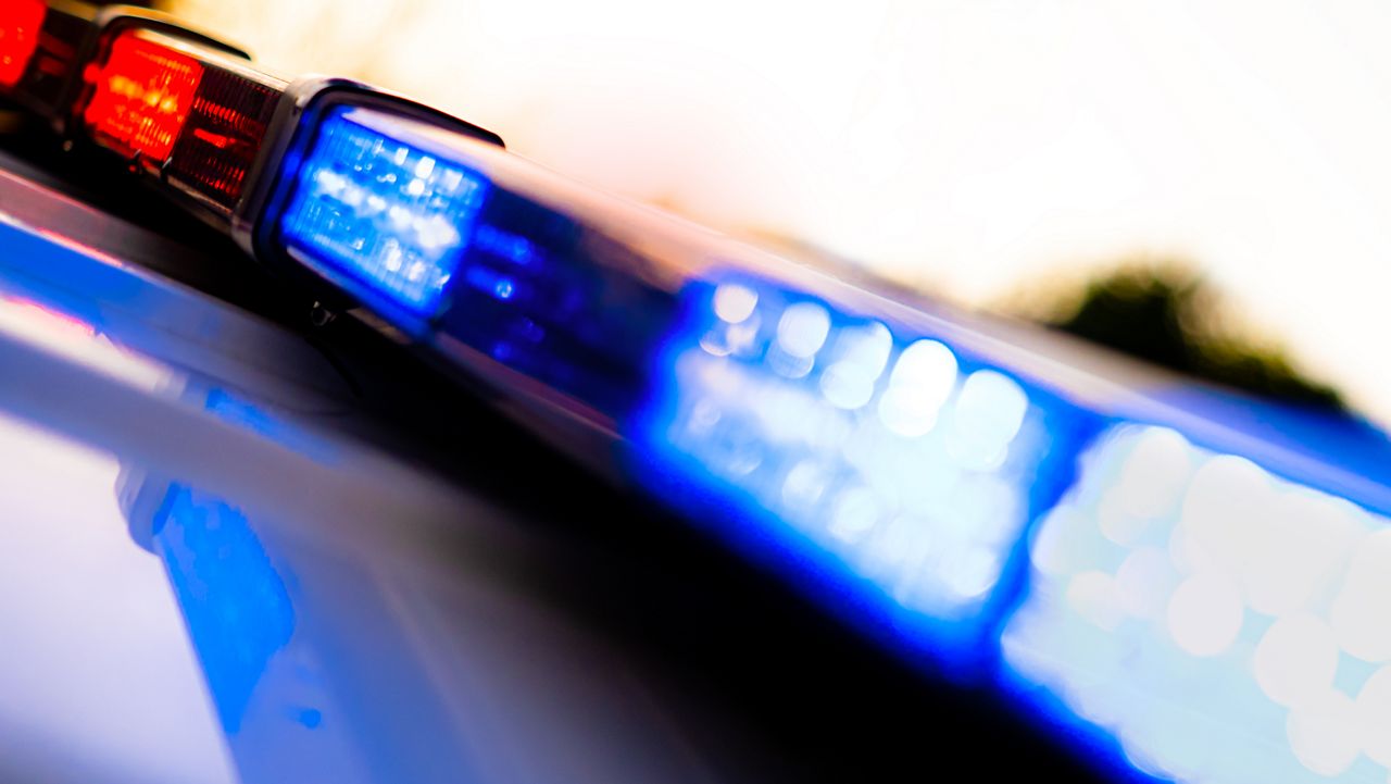 Police vehicle flashing lights.