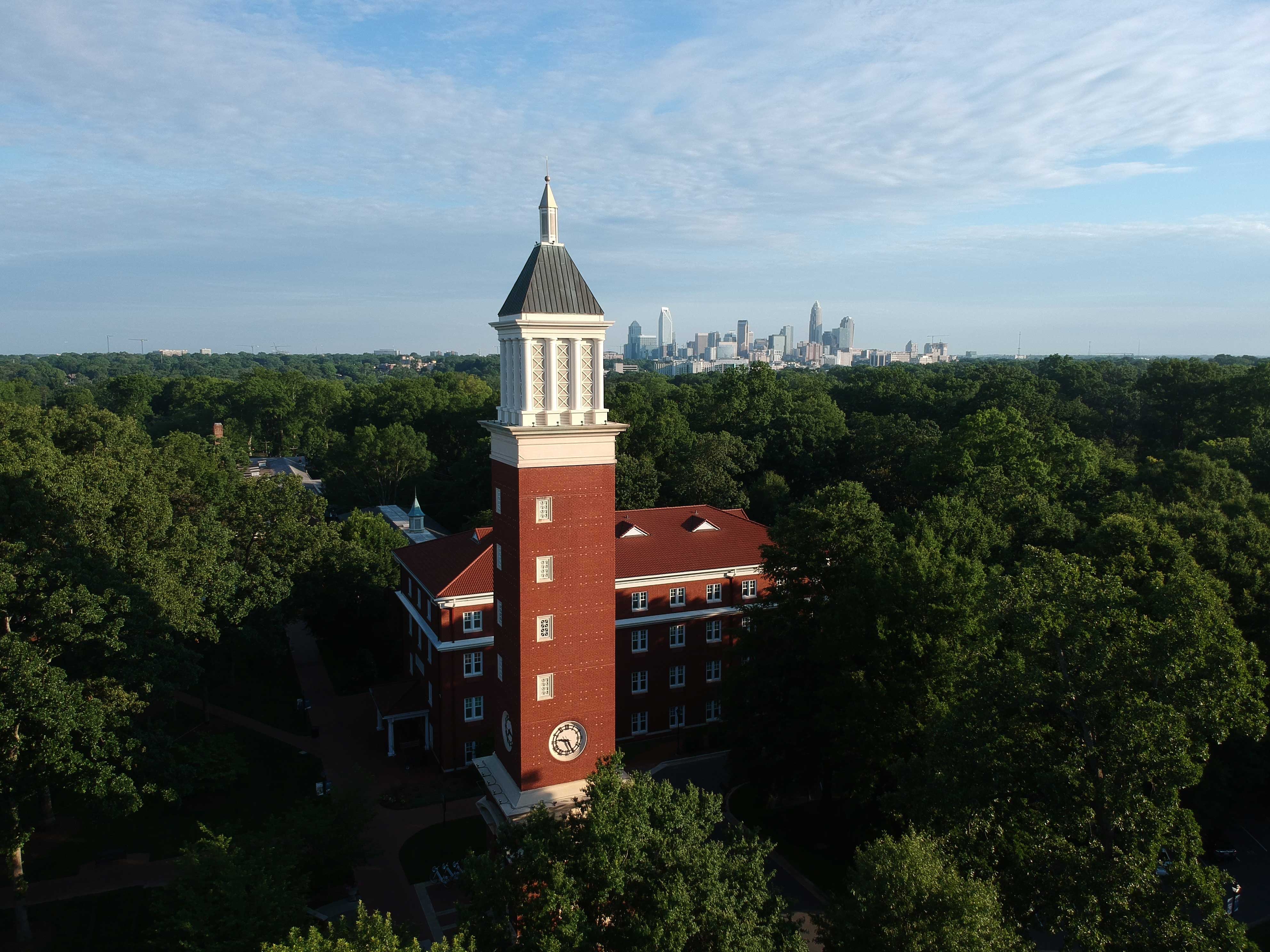 Aerial photo of the Queens University of Charlotte campus with the Charlotte skyline in the background.