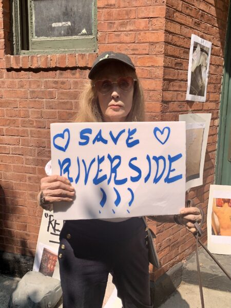 Amanda Trees, who was born at Riverside Houses, said she gives her dog medicine so he doesn’t get ticks or mites. Photo: Mary Frost/Brooklyn Eagle