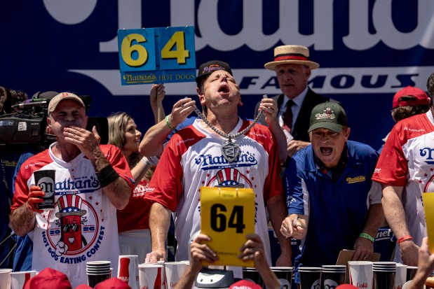 Joey Chestnut takes a deep breath as time is called in the 2026 Nathan's Famous Fourth of July hot dog eating contest at Coney Island in the Brooklyn borough of New York, Saturday, July 4, 2026. (AP Photo/Anna Connors)