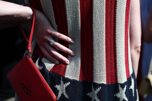 A detailed view of a visitor\'s American flag-themed clothing as they wait in line to attend the fireworks show during "Salute to America 250" Fourth of July celebrations on the National Mall on July 04, 2026 in Washington, DC. Americans are celebrating the nation's 250th anniversary amidst an extreme heat wave bringing dangerous triple digit temperatures to much of the eastern United States. (Photo by Finn Gomez/Getty Images)