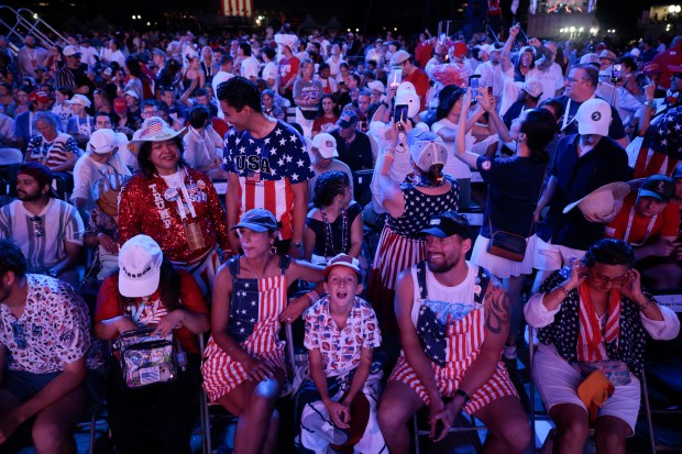 Visitors re-enter the "Salute to America 250" Fourth of July celebrations after severe weather conditions on the National Mall on July 04, 2026 in Washington, DC. Americans are celebrating the nation's 250th anniversary amidst an extreme heat wave bringing dangerous triple digit temperatures to much of the eastern United States. (Photo by Chip Somodevilla/Getty Images)