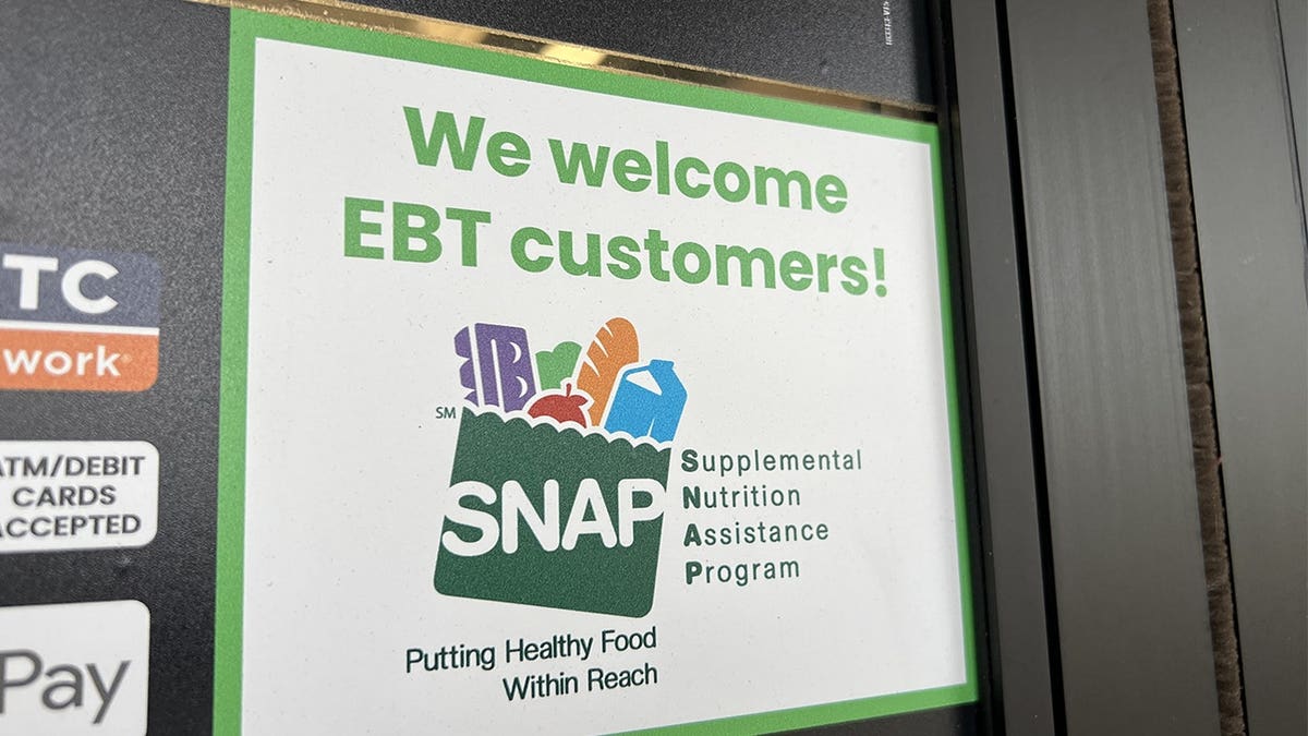 Sign at supermarket entrance with text reading We Welcome EBT customers and a SNAP logo in Lafayette, California, November 13, 2025.