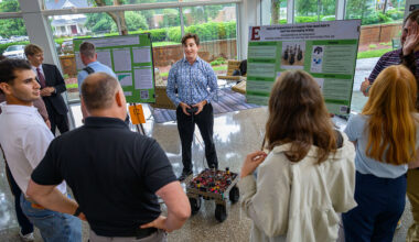 Elon and Queens students present research at summer symposium