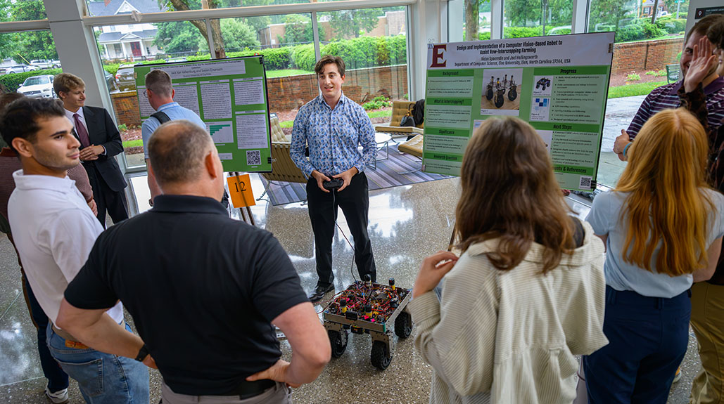 Elon and Queens students present research at summer symposium