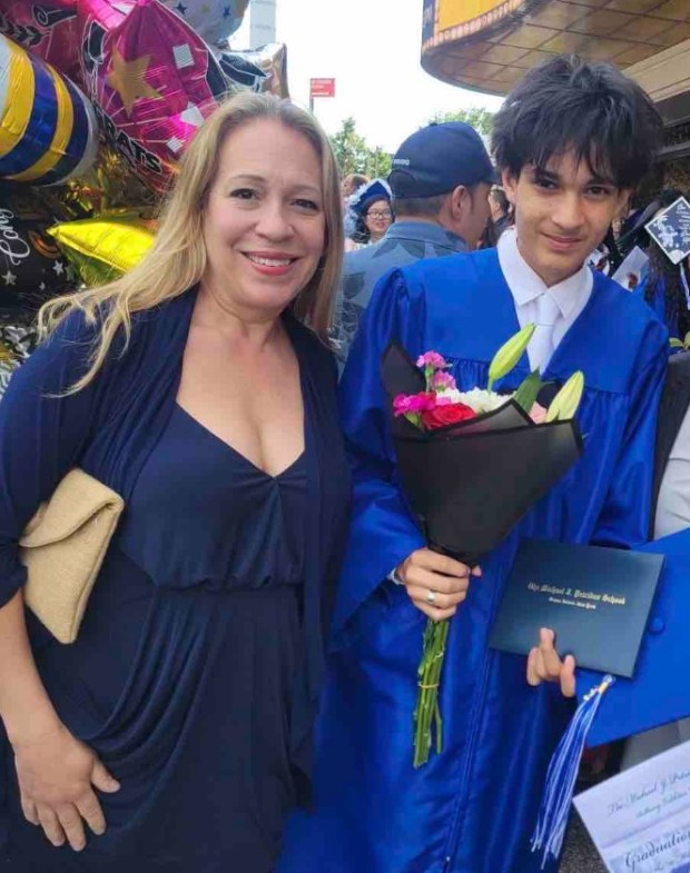 Diana Rolon is pictured with her son, Michael, at his high school graduation. (GoFundMe)