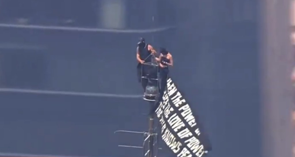 Daredevil couple climb spire atop Empire State Building in apparent marriage proposal
