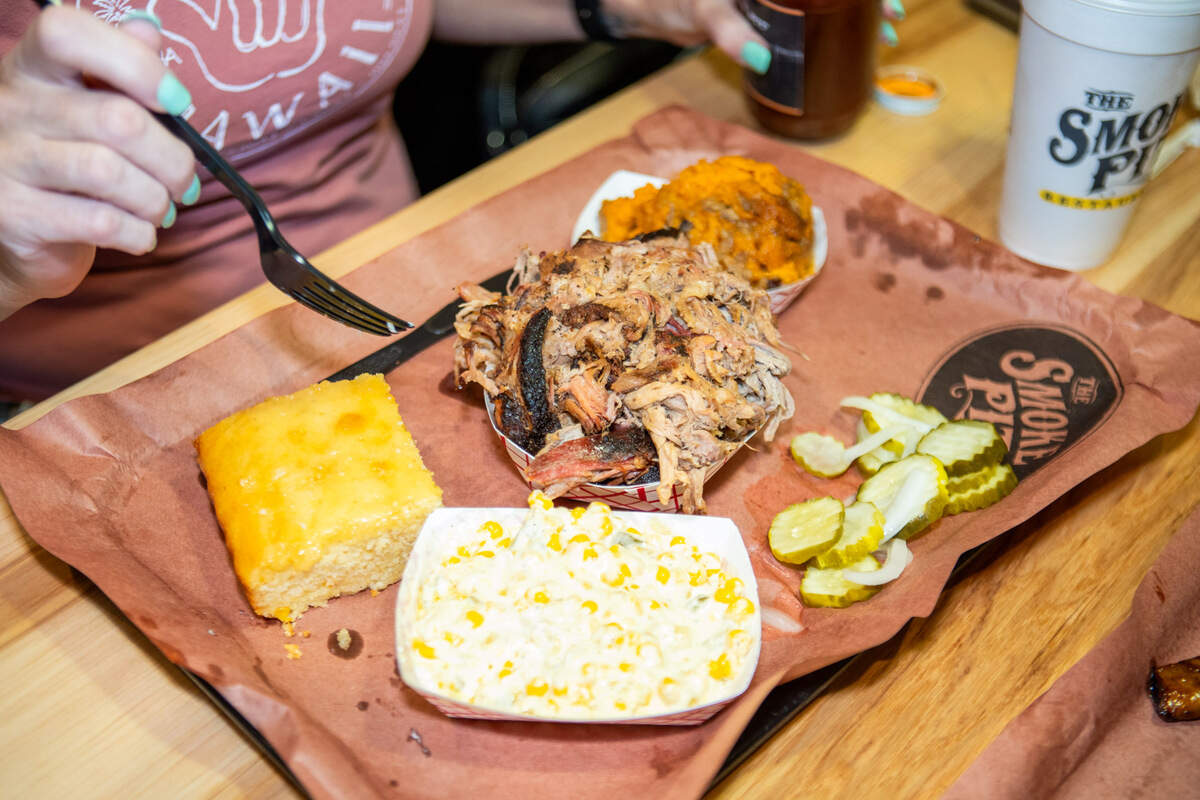 Hickory smoked pulled pork with cornbread and sweet potato casserole at The Smoke Pit in Concord..
