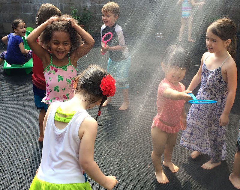 Kids cooling off in Brooklyn sprinklers