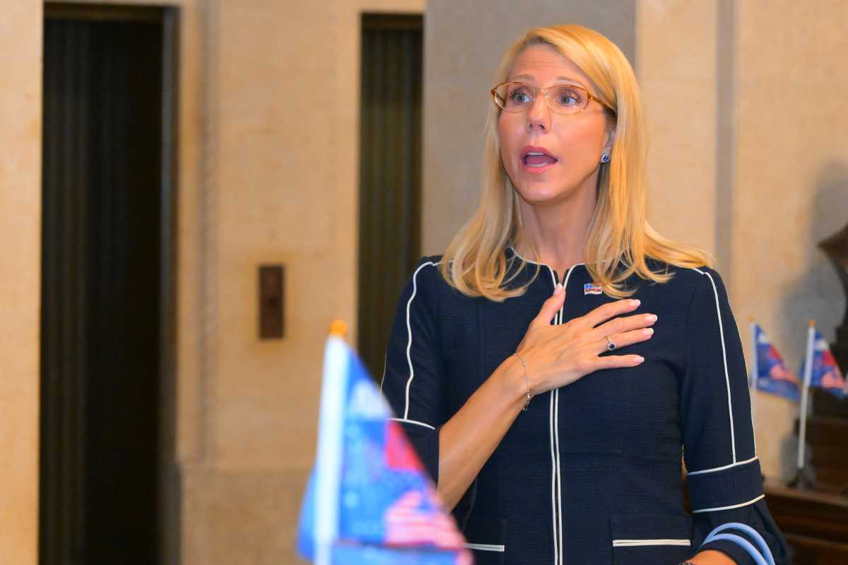 Hon. Suzanne Adams, Adminstrative Judge, recites the Pledge of Allegiance