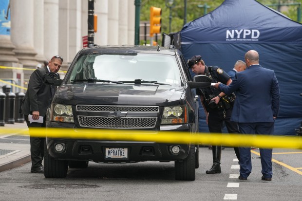 NYPD officers and detectives investigate a fatal bike-car accident on Centre St. near Chambers St. Wednesday, July 29 2026 in New York, New York. (Barry Williams/ New York Daily News)