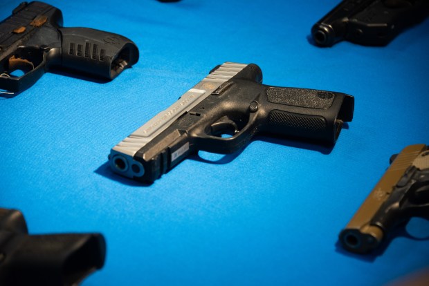 Seized guns are displayed as Brooklyn District Attorney Eric Gonzalez and NYPD Commissioner Jessica Tisch announce a gang takedown at the Kings County DA's Office in Brooklyn, New York on April 15, 2026. (Gardiner Anderson / New York Daily News)