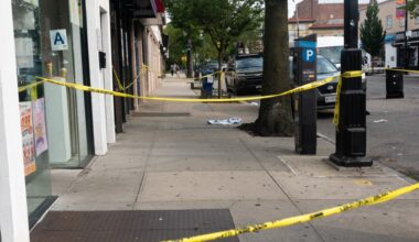 Off-duty NYPD cop stabbed in front of Queens deli, police search for 2 suspects