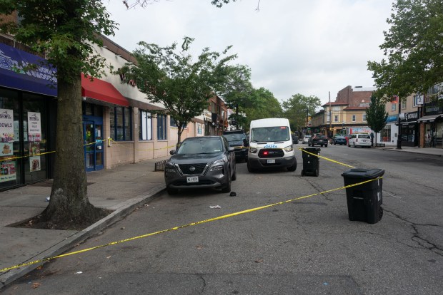 Police secure a crime scene after an off-duty officer was slashed on Bell Blvd. near 39th Ave. in Bayside, Queens, on Wednesday, July 22, 2026. (Gardiner Anderson / New York Daily News)