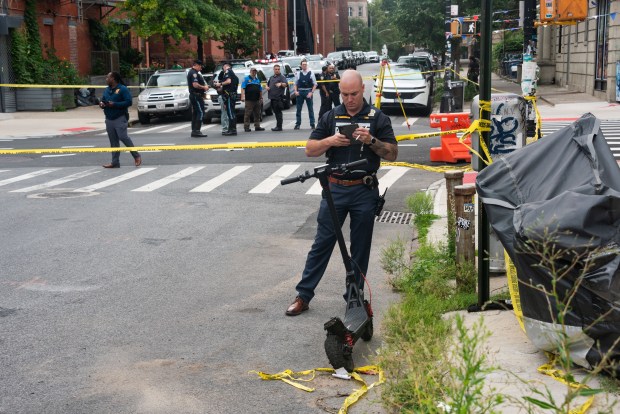 Police investigate a collision involving a truck and an electric scooter on Pacific St. and Franklin Ave. in Brooklyn, New York City on Tuesday, July 26, 2026. (Gardiner Anderson / New York Daily News)