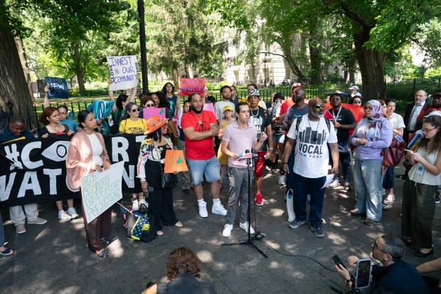 An activist speaks during a press conference urging Mayor Mamdani to reject a planned increase in headcount in the NYPD outside New York City Hall Thursday, June 25, 2026 in the Manhattan, New York. (Barry Williams/ New York Daily News/Pool)
