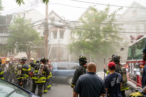 Five firefighters were hurt when a massive four-alarm blaze destroyed two homes after a fire erupted in the basement of a Briggs Ave. home near E. 194th St. in the Bronx on Thursday, July 16, 2026. (Theodore Parisienne / New York Daily News)