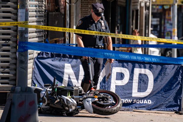 A 25yr old man operating a white 2007 Kawasaki motorcycle westbound on Roosevelt Avenue was pronounced dead on scene after a box truck driven by a 57yr old man also traveling westbound on Roosevelt Avenue smashed into him as it was turning right to head northbound on 64th Street in Queens on Thursday July 2, 2026. 0905. (Theodore Parisienne / New York Daily News)