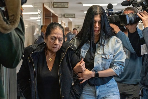 María Paz Peñaloza Cabrera's mother, Gladys Cabrera (left), and sister are pictured in Queens Supreme Court after Felipe Hoyos Foronda's arraignment on Monday, April 28, 2025. (Theodore Parisienne / New York Daily News)