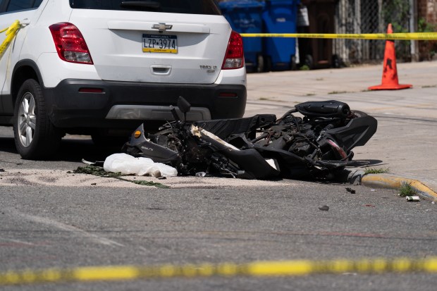 A 13-year-old boy riding on the back of a moped was killed, and another 13-year-old who was driving the moped was injured on 162nd St. near 45th Ave. in Flushing, Queens on Monday, June 29, 2026. (Theodore Parisienne / New York Daily News)
