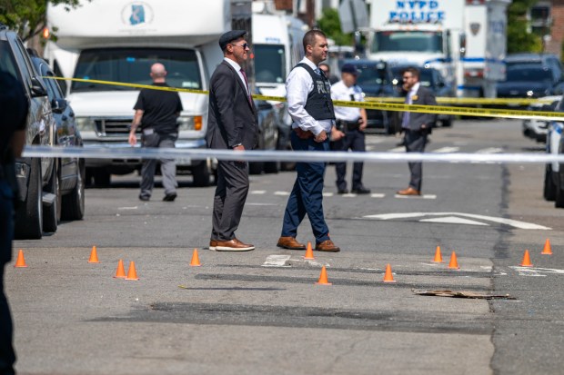 NYPD officers shot and wounded armed suspect Keegan Thompson at a Queens home on Ocean Crest Blvd. near Hartman Ln. in Far Rockaway, where two of the suspect's relatives were found dead and a fire was started on Saturday, July 25, 2026. (Theodore Parisienne / New York Daily News)