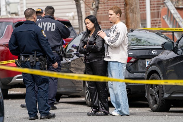 Yokasta Ortega (left) and Jayden Ortega, mother and brother of Jeremy Ortega, are pictured at the scene of the shooting on Quincy Ave. in the Bronx on Sunday, April 13, 2025. (Theodore Parisienne / New York Daily News)