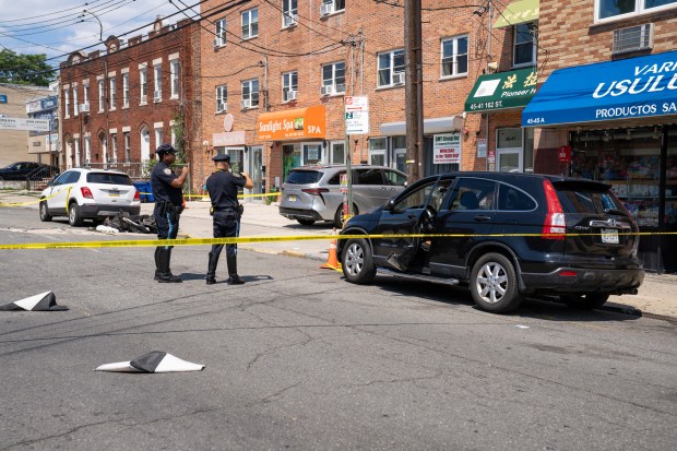 A 13-year-old boy riding on the back of a moped was killed, and another 13-year-old who was driving the moped was injured on 162nd St. near 45th Ave. in Flushing, Queens on Monday, June 29, 2026. (Theodore Parisienne / New York Daily News)