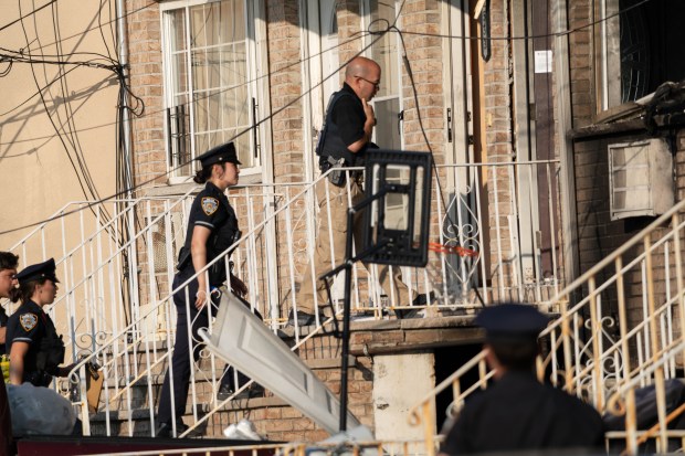 Police shot and wounded armed suspect Kegan Thomas at a home in Far Rockaway, where two of the suspect's relatives were found dead and a fire was started on Saturday.
