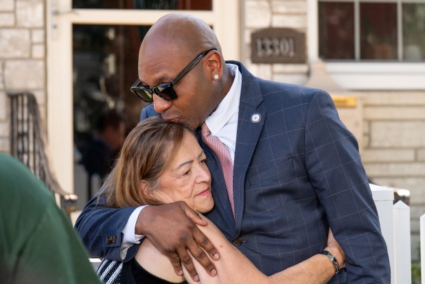Queens Borough President Donovan Richards consoles a family member of Sgt. Angel Sarah Rampersad during a press conference in front of Rampersad's home on 96th St. in Ozone Park, Queens on Thursday, July 23, 2026. (Theodore Parisienne / New York Daily News)
