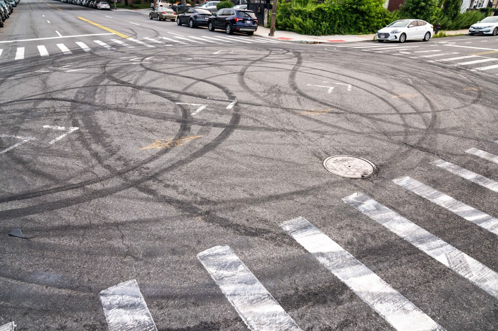 NYPD car rammed by BMW and its tires slashed at wild Brooklyn street takeover