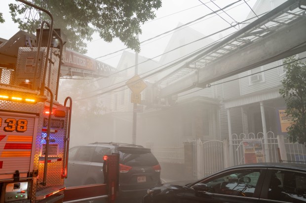 Five firefighters were hurt when a massive four-alarm blaze destroyed two homes after a fire erupted in the basement of a Briggs Ave. home near E. 194th St. in the Bronx on Thursday, July 16, 2026. (Theodore Parisienne / New York Daily News)