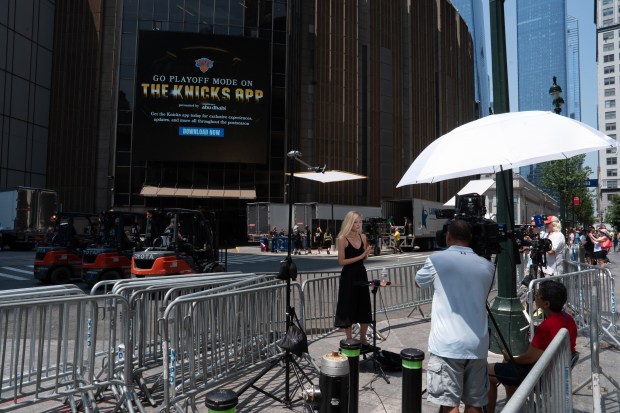 A reporter is pictured outside Madison Square Garden on Wednesday, July 1, 2026, after rumors of an upcoming Taylor Swift and Travis Kelce wedding. (Barry Williams/ New York Daily News)