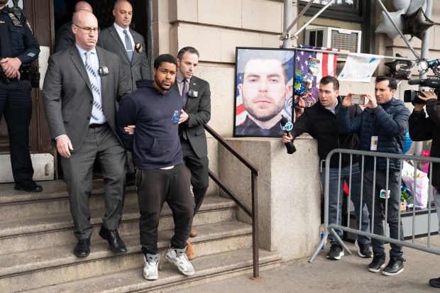 Lindy Jones is pictured in police custody leaving the NYPD 101st Precinct stationhouse on Wednesday, March 27, 2024 in Queens, New York. (Barry Williams for New York Daily News)