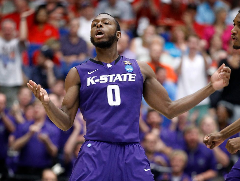 Kansas State's Jacob Pullen (0) celebrates breaking his school's all-time scoring record...