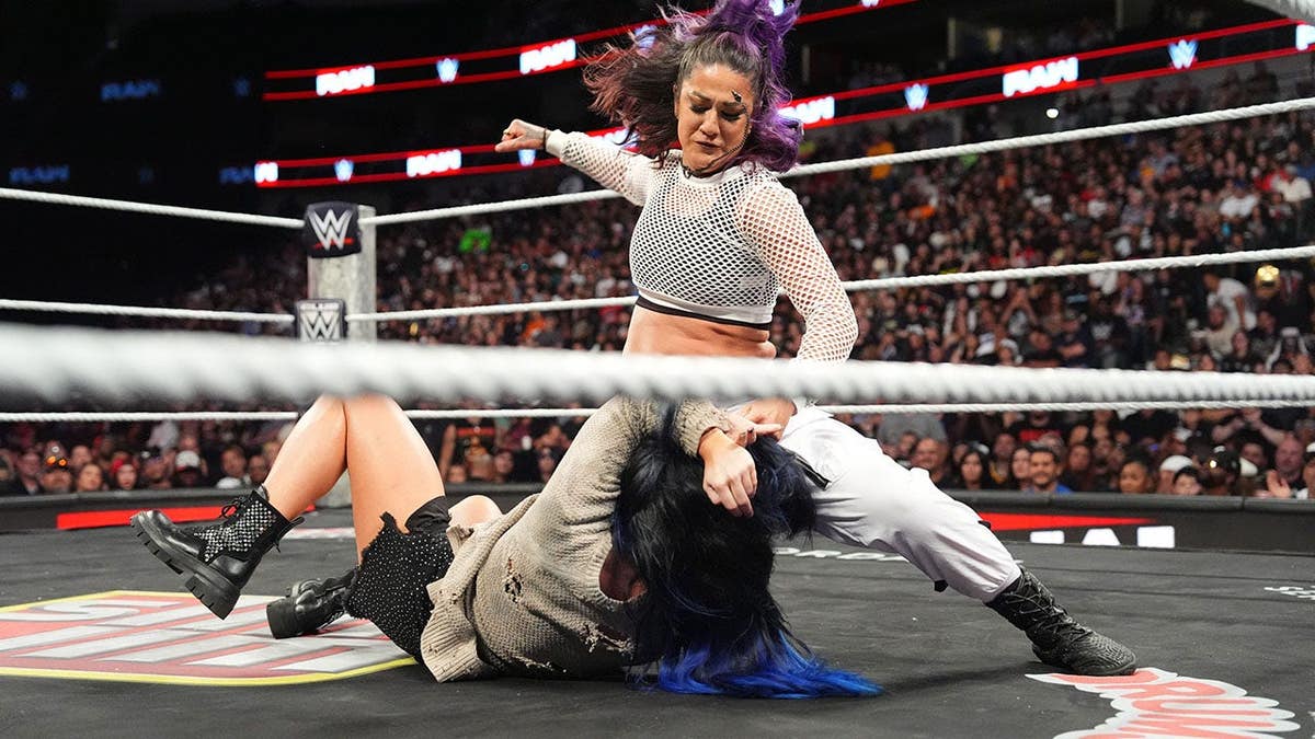 Bayley wrestles Lyra Valkyria in the ring at American Airlines Center.