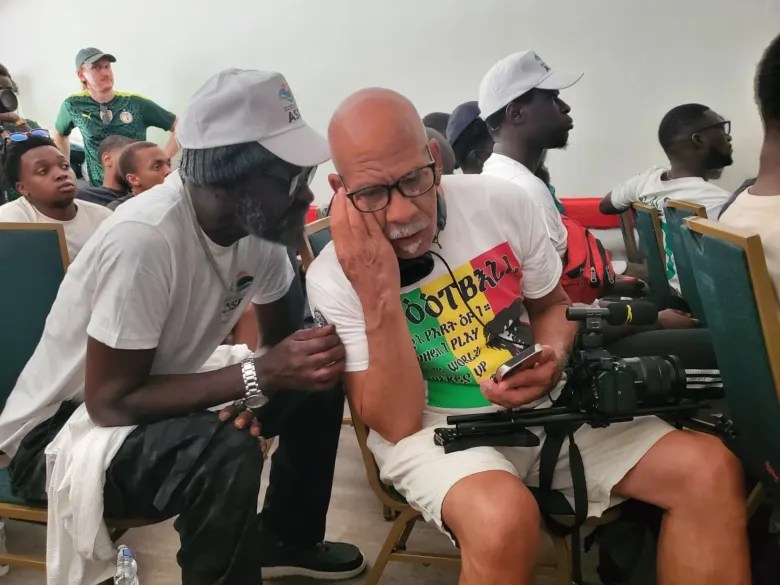Victor Sanchez and fans at a Senegalese Association watch party shared play-by-play updates from live phone feeds, congratulations and words of comfort as the match unfolded. Credit: Ambar Castillo / Epicenter NYC