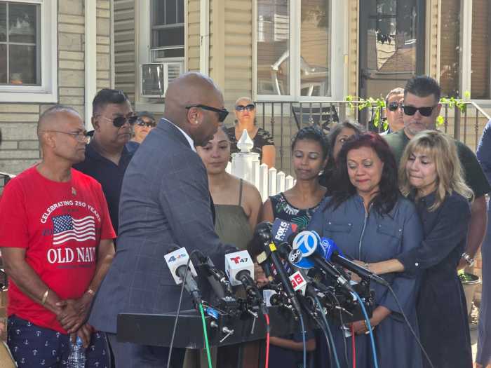 Queens Borough President Donovan Richards consoles Rampersad's mother Carol. Photo by Shane O'Brien.