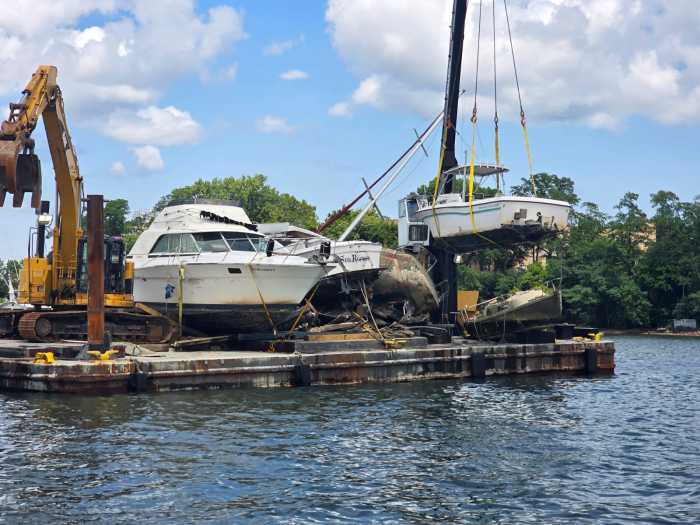 An abandoned vessel is removed from Flushing Bay. Photo by Shane O'Brien.