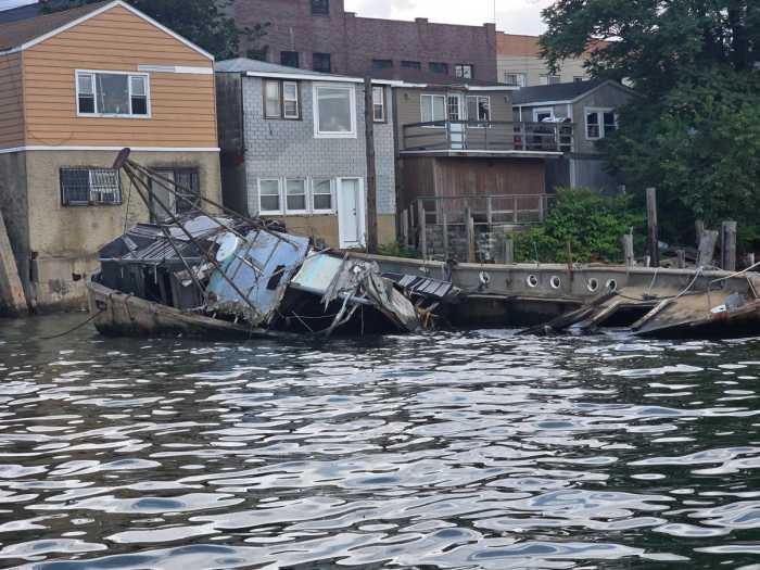 An abandoned vessel near Big Rock Beach in College Point. Photo by Shane O'Brien.