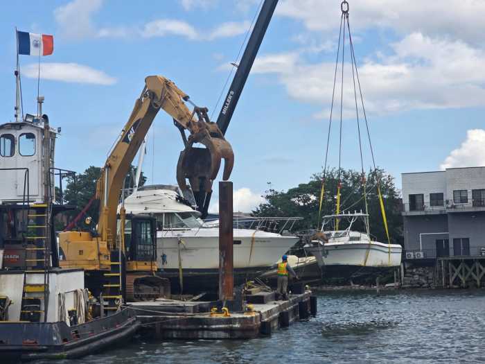 An abandoned vessel is removed from Flushing Bay. Photo by Shane O'Brien.