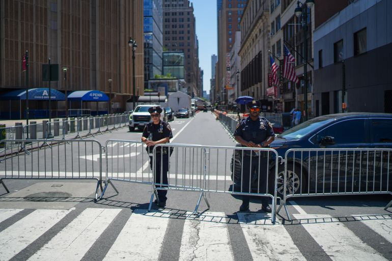 NYPD officers stand on a closed road next to Madison Square Garden ahead of a reported wedding between singer Taylor Swift and National Football League player Travis Kelce on Friday, July 3, 2026, in New York. (AP Photo/Ryan Murphy)