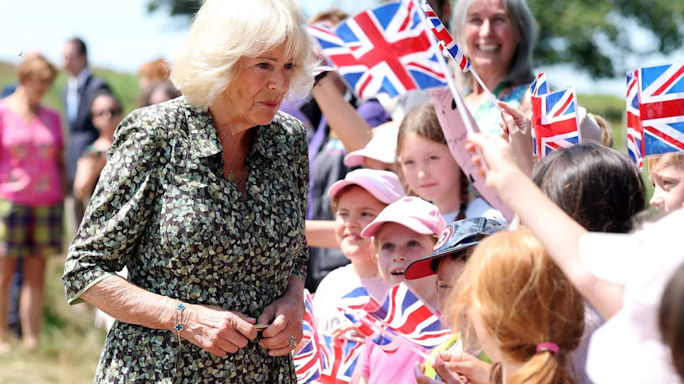 Queen Camilla, Patron of the Royal Literary Fund, speaks with local school children during a visit to Ashdown Forest near Hartfield, East Sussex, to commemorate 100 years since the publication of the first Winnie the Pooh book in 1926. Ashdown Forest was the inspiration for the original Hundred Acre Wood and former home of author, A A Milne