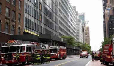 Firefighters gather outside of the former Pfizer headquarters on East 42nd Street near Grand Central Terminal, in New York, on July 7.