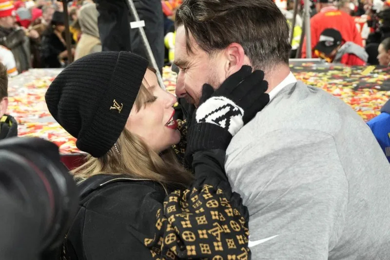 Kansas City Chiefs tight end Travis Kelce and his Taylor Swift embrace on the field after the Chiefs defeated the Buffalo Bills 32-29 in the AFC Championship Game at Arrowhead Stadium in Kansas City, Mo., on January 26. File Photo by Jon Robichaud/UPI