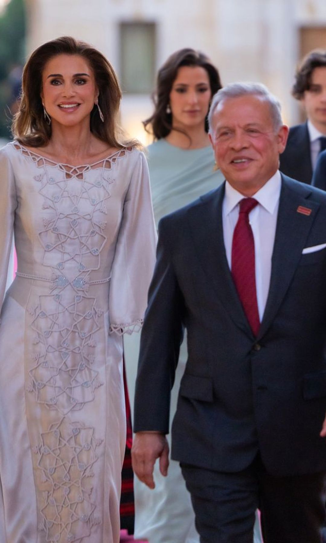 King Abdullah and Queen Rania share a joyful moment with their children at the reception following the ceremony.