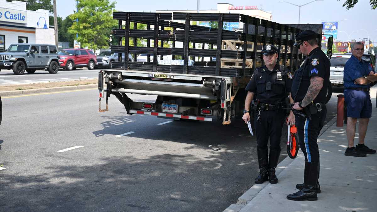 police officers in Brooklyn near truck involved in hit-and-run crash