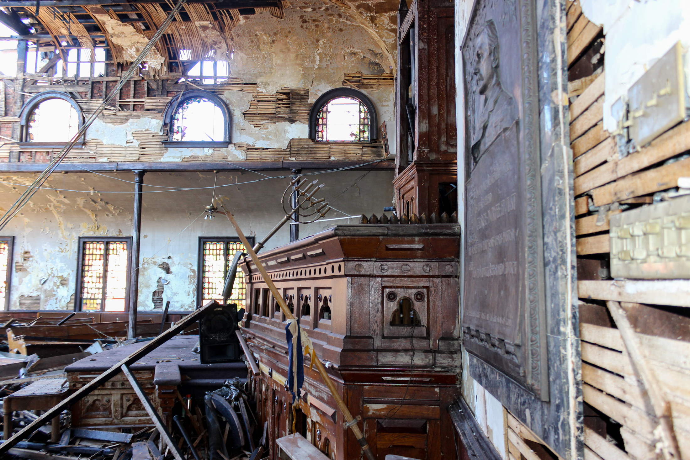 sanctuary after a fire with broken windows, fallen timbers