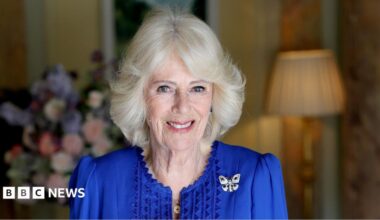 A picture of Queen Camilla in a blue dress